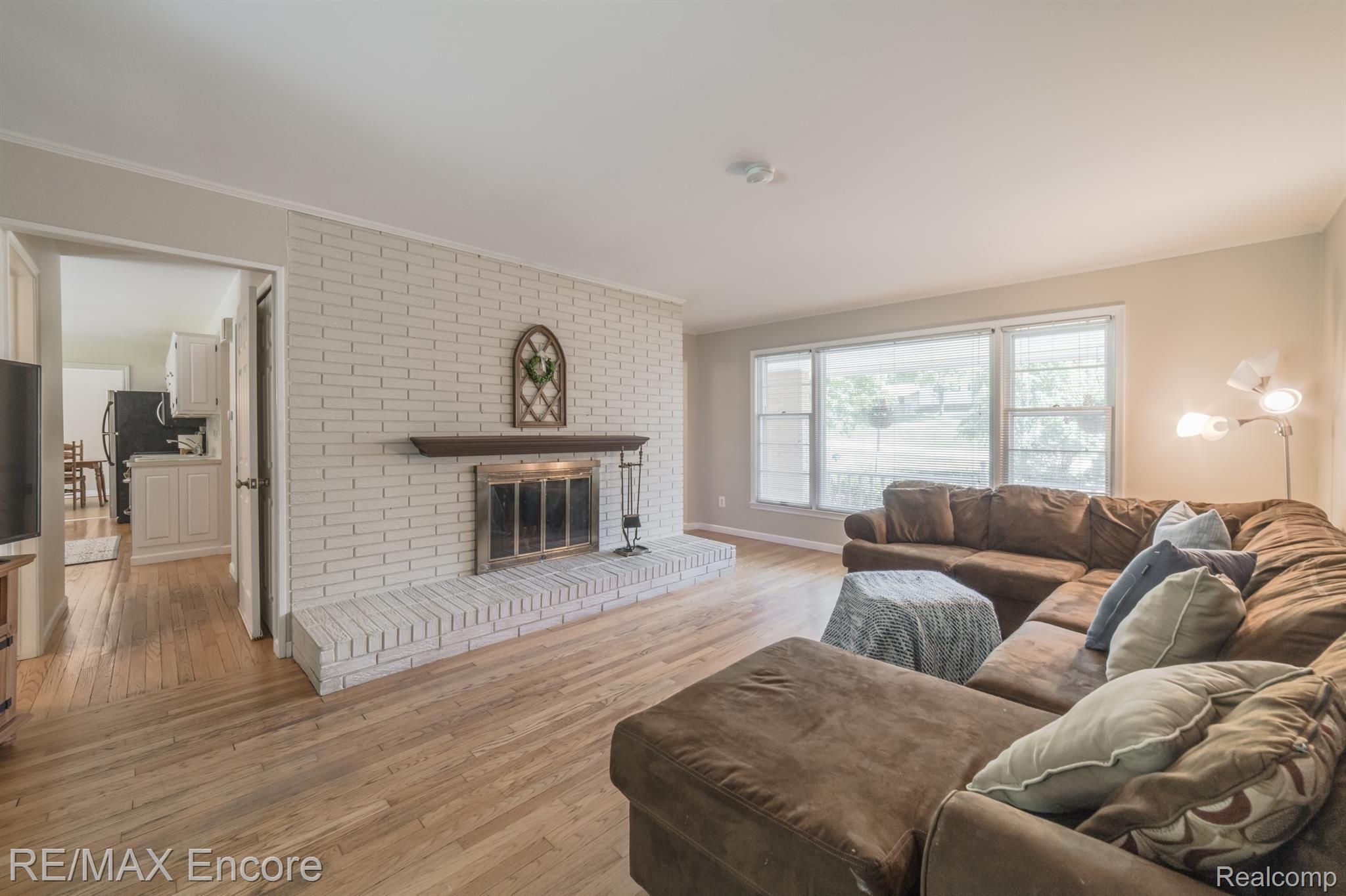 2555 New England Drive Rochester, MI 48309 - Photo 20 of 61 Wood burning brick fireplace with mantel
