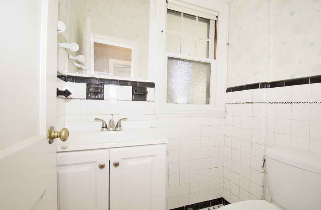 102 Florence Street Springfield, MA 01105 - Photo 15 of 30 a bathroom with a sink and a mirror