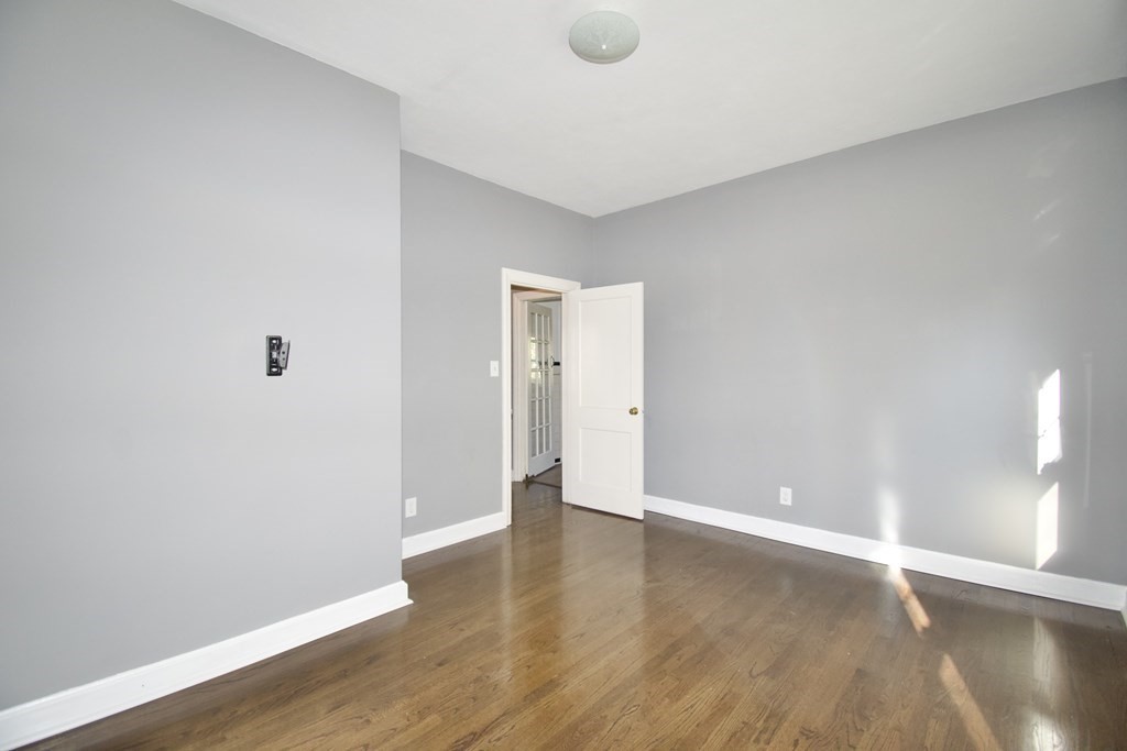 102 Florence Street Springfield, MA 01105 - Photo 17 of 30 a view of an empty room with wooden floor