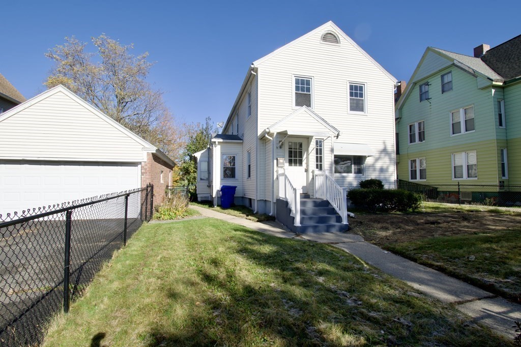 102 Florence Street Springfield, MA 01105 - Photo 2 of 30 a view of white house with a yard