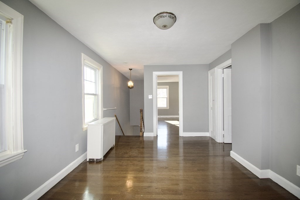 102 Florence Street Springfield, MA 01105 - Photo 21 of 30 a view of empty room with wooden floor and fan