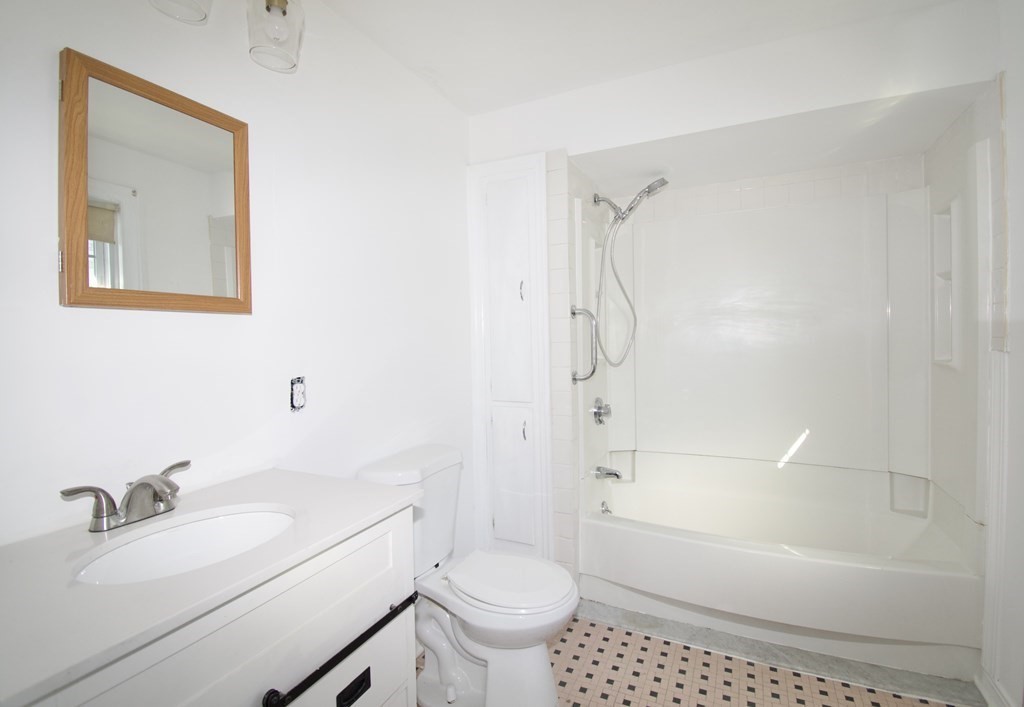 102 Florence Street Springfield, MA 01105 - Photo 23 of 30 a bathroom with a sink toilet and shower