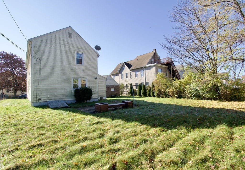 102 Florence Street Springfield, MA 01105 - Photo 26 of 30 a front view of a house with a yard
