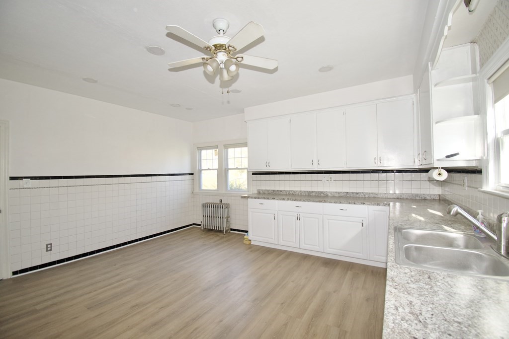 102 Florence Street Springfield, MA 01105 - Photo 30 of 30 a view of a kitchen with wooden floor and a window