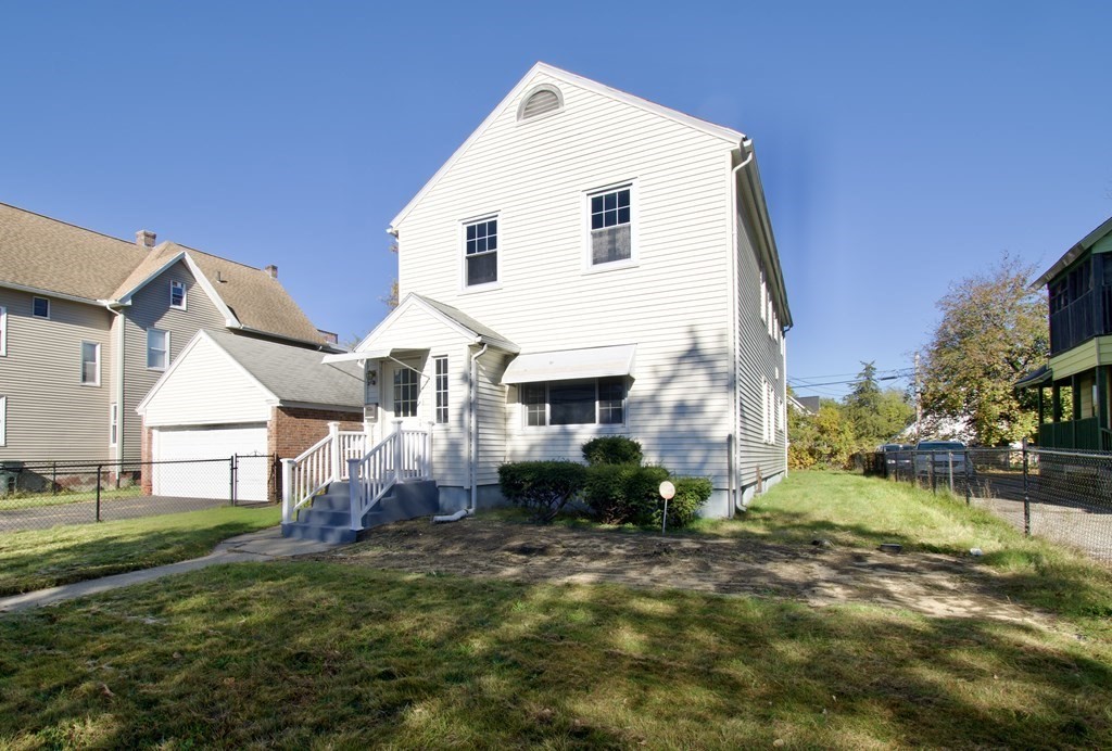 102 Florence Street Springfield, MA 01105 - Photo 4 of 30 a view of a house with a yard