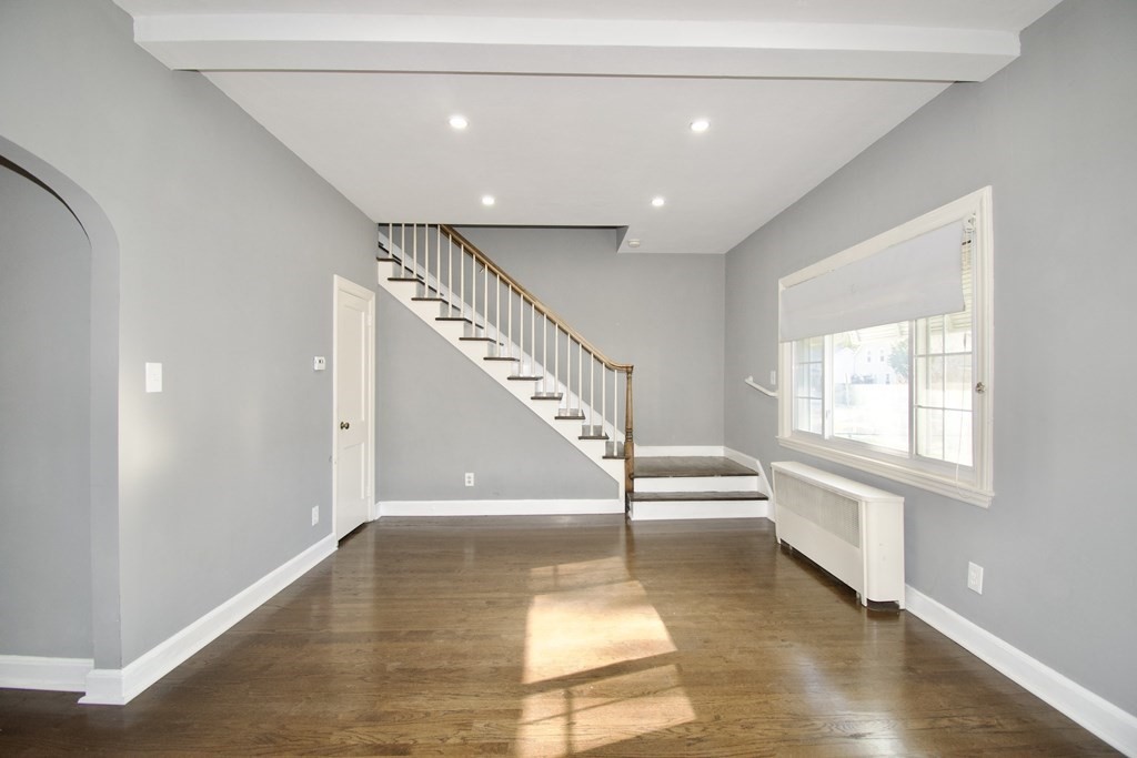 102 Florence Street Springfield, MA 01105 - Photo 5 of 30 a view of entryway and hall with wooden floor