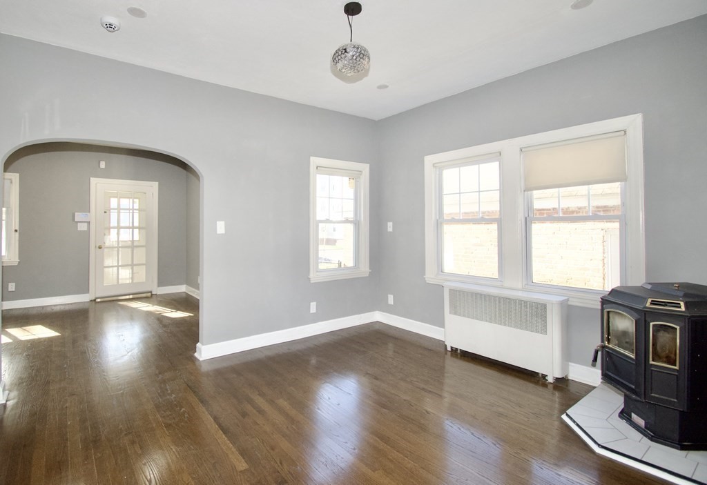 102 Florence Street Springfield, MA 01105 - Photo 8 of 30 a view of livingroom with hardwood floor and a window