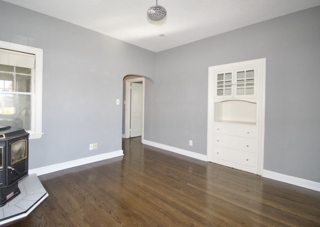 102 Florence Street Springfield, MA 01105 - Photo 10 of 30 an empty room with wooden floor and windows
