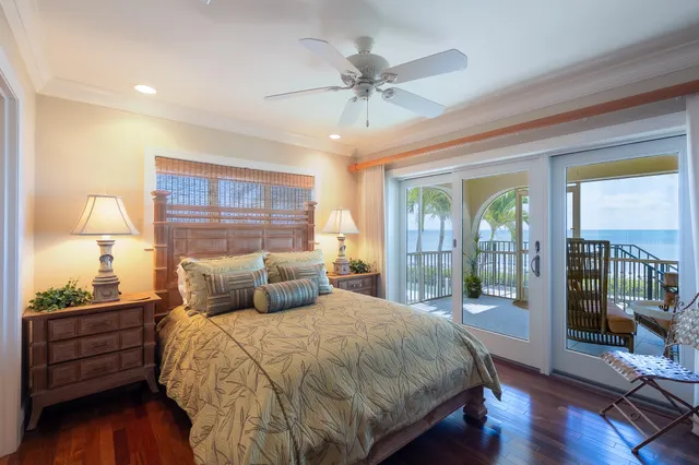 a bathroom with a granite countertop sink a toilet a mirror and shower