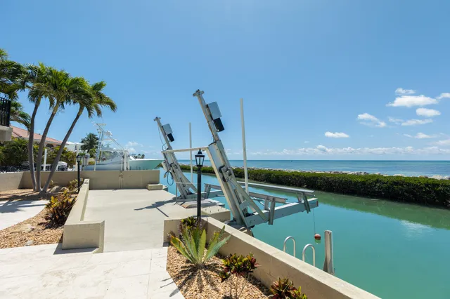 a view of a backyard with swimming pool