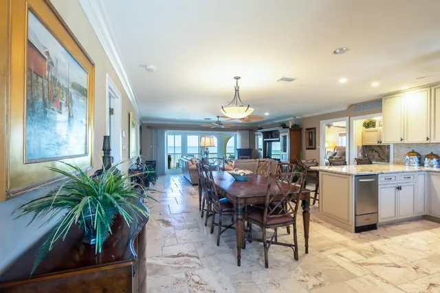a living room with furniture ceiling fan and a rug