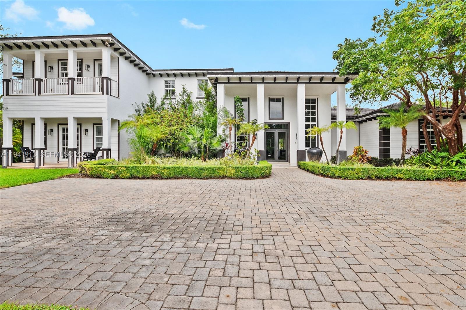 a front view of a building with garden