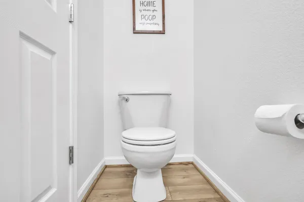 a bathroom with a toilet and a sink