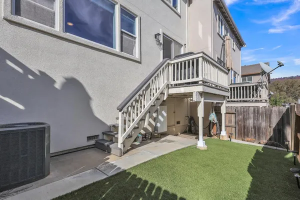 a view of front door of house with a yard