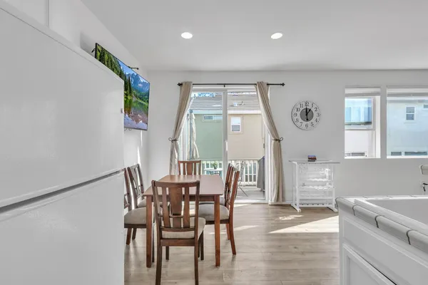 a view of a dining room with furniture and window