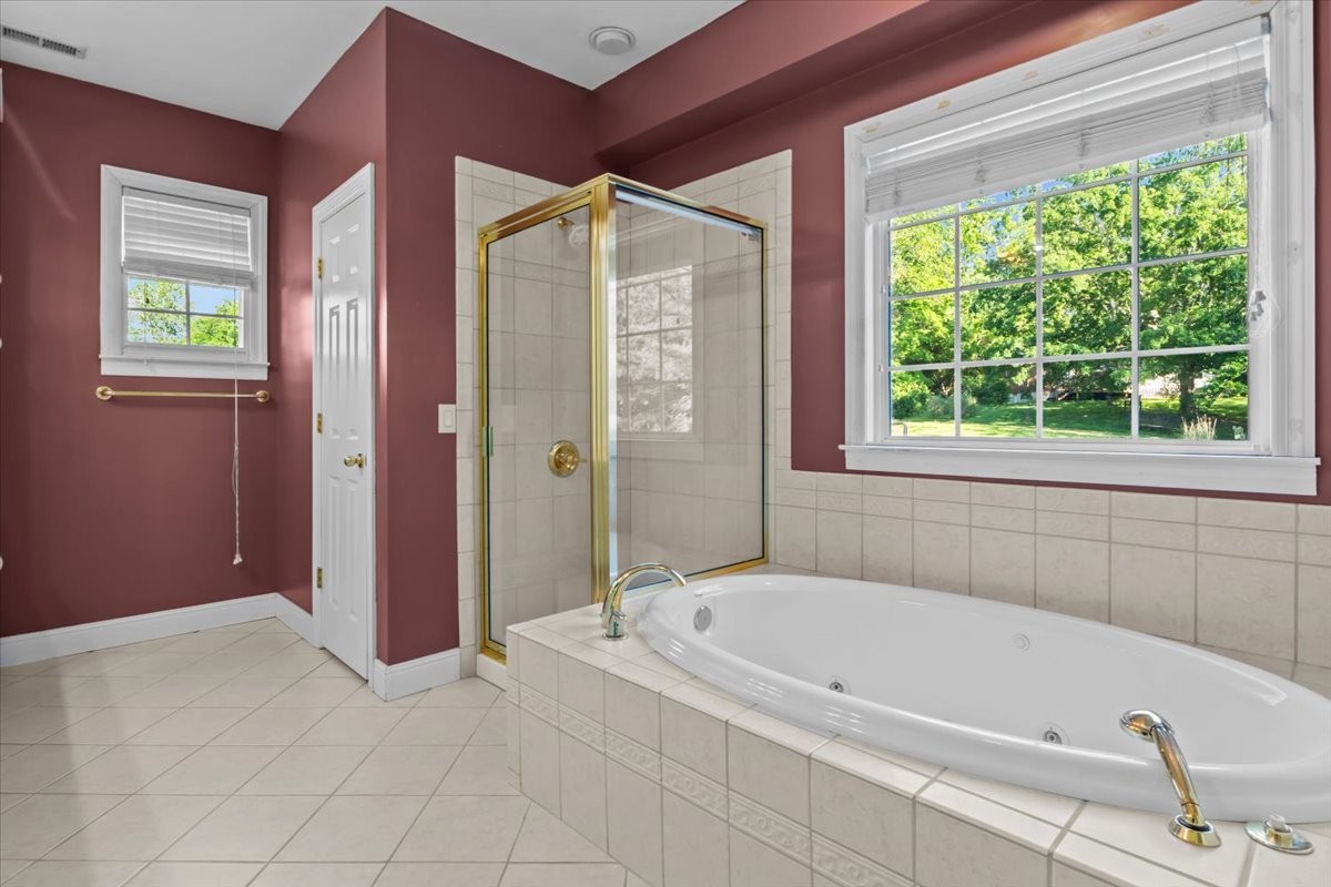2440 Maple Grove Road Dickson, TN 37055 - Photo 20 of 87 a bathroom with a bathtub and a shower