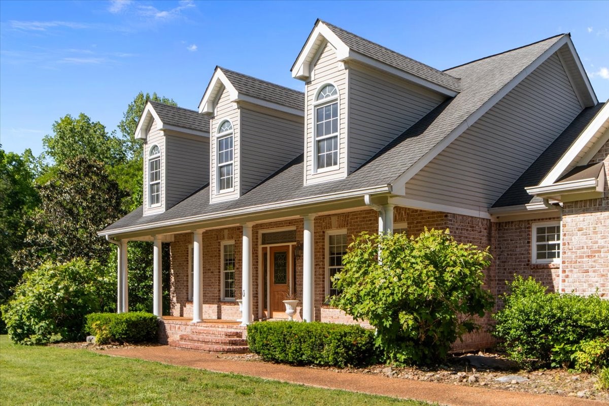 2440 Maple Grove Road Dickson, TN 37055 - Photo 2 of 87 a view of a house with yard and plants