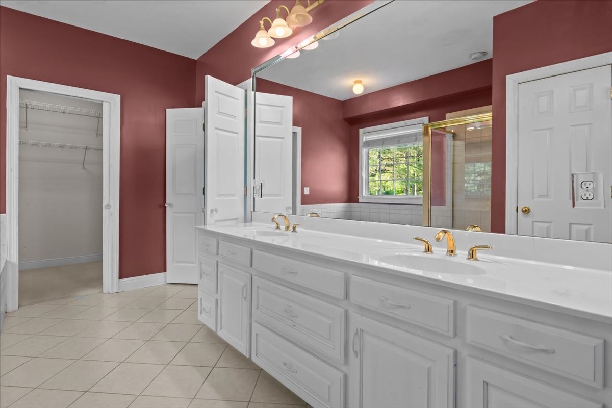 2440 Maple Grove Road Dickson, TN 37055 - Photo 22 of 87 a bathroom with double sink and a mirror