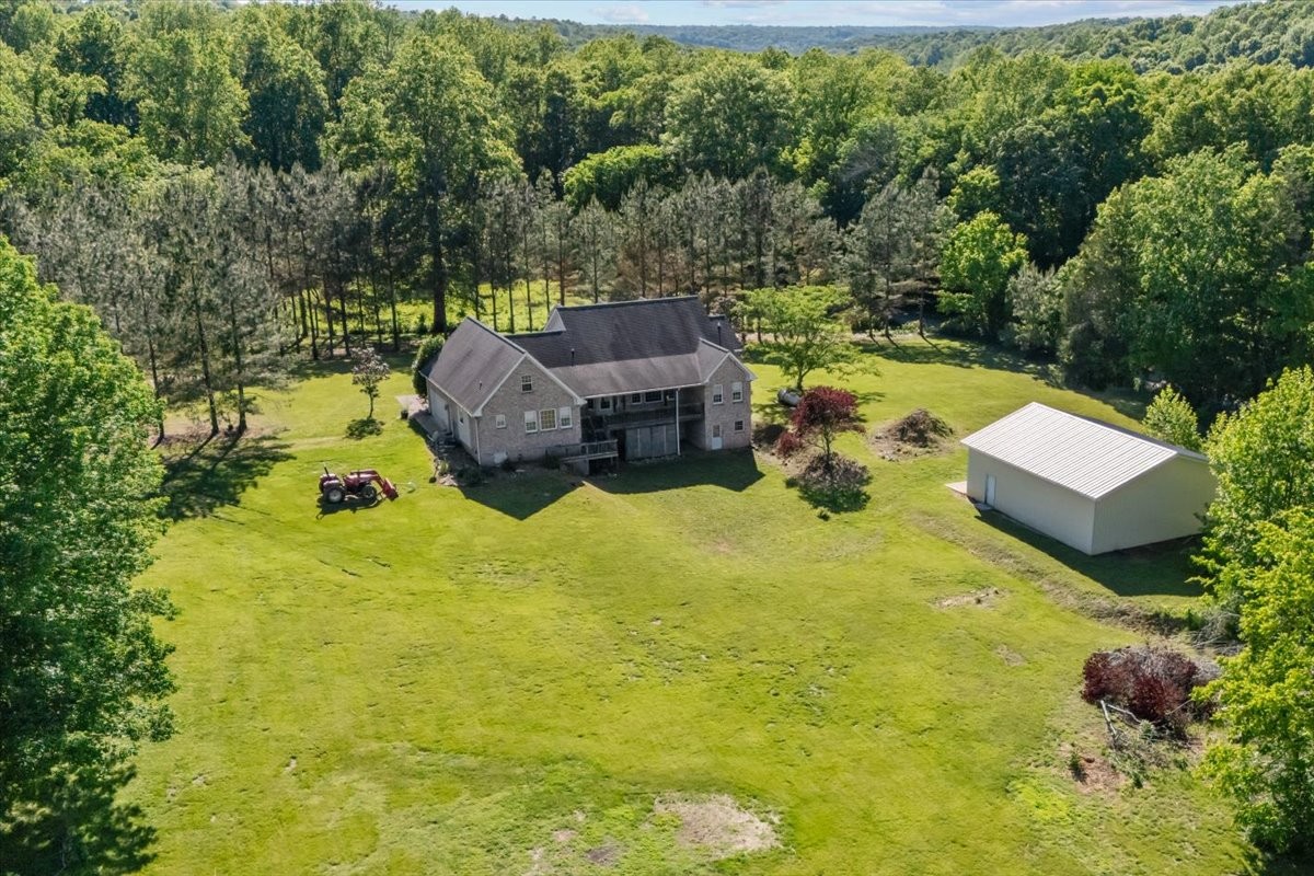 2440 Maple Grove Road Dickson, TN 37055 - Photo 47 of 87 a view of a swimming pool with a garden