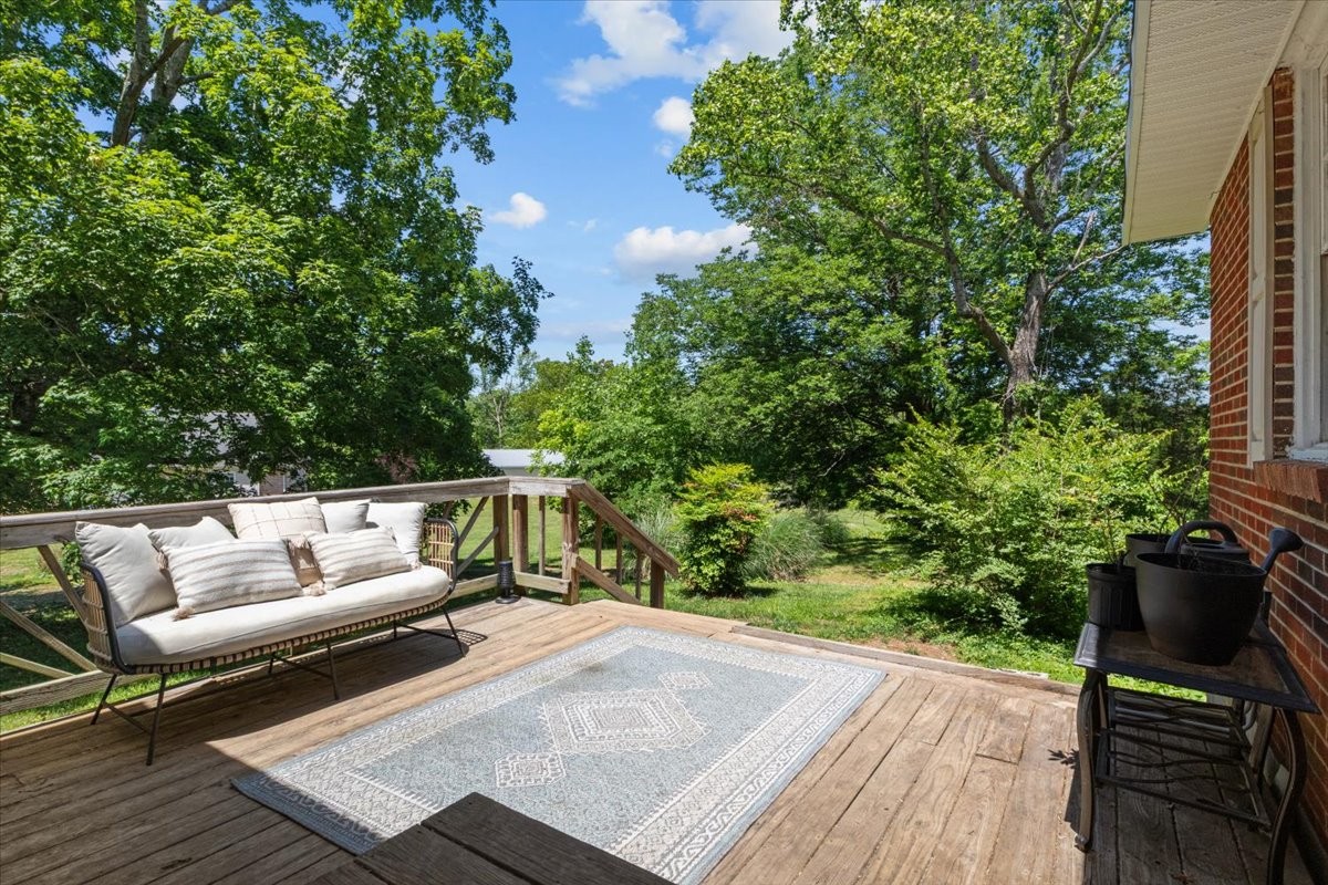 2440 Maple Grove Road Dickson, TN 37055 - Photo 60 of 87 a balcony with wooden floor and outdoor seating