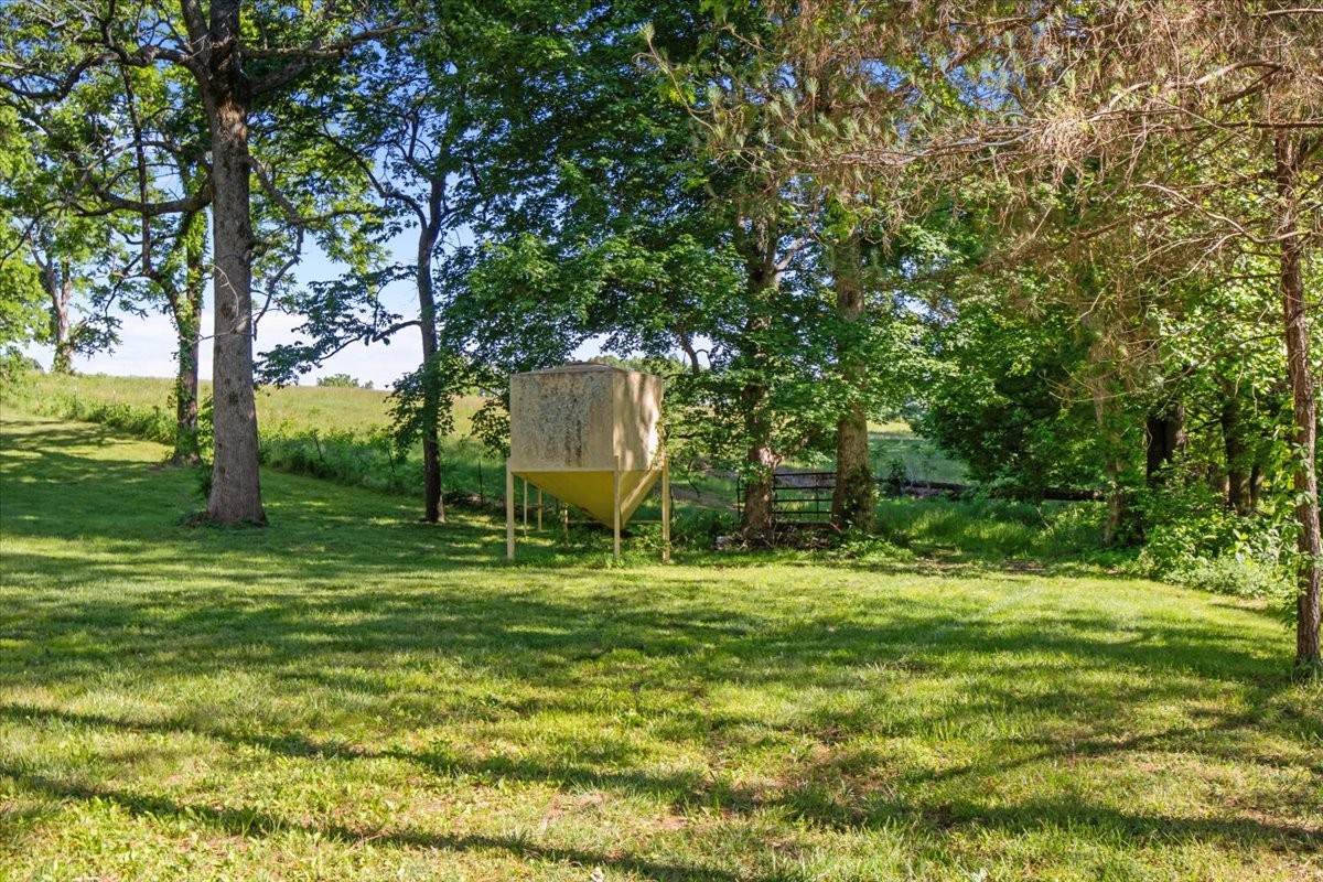 2440 Maple Grove Road Dickson, TN 37055 - Photo 74 of 87 a backyard of a house with table and chairs