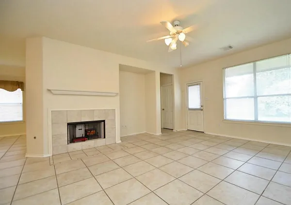 a white stove top oven sitting inside of a kitchen