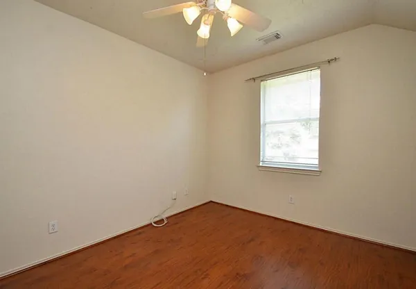 a view of a livingroom with a chandelier fan