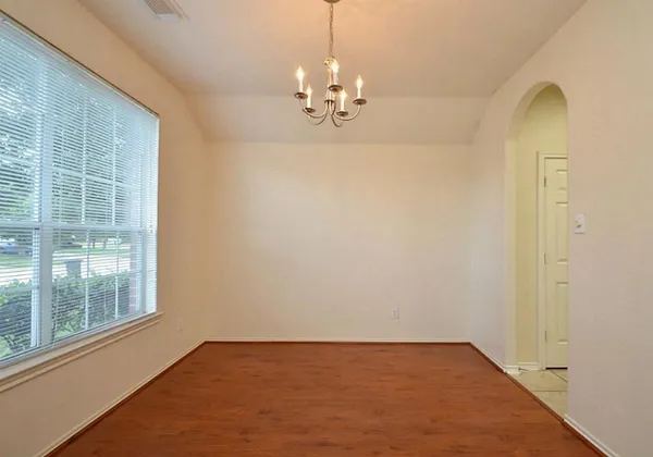 a bathroom with a tub a shower a sink and a toilet