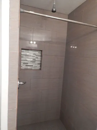 a bathroom with a glass shower door