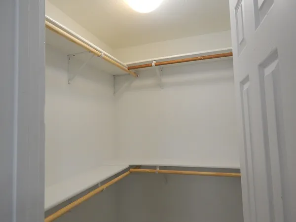 a view of an empty walk in closet