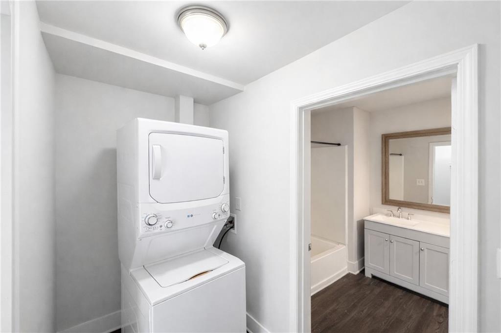 161 Mangum Street Southwest, Unit 204 Atlanta, GA 30313 - Photo 17 of 24 a view of bathroom with a toilet sink and a mirror