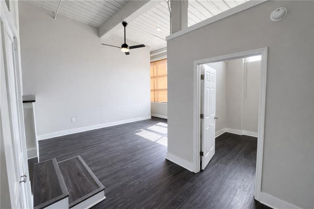 161 Mangum Street Southwest, Unit 204 Atlanta, GA 30313 - Photo 3 of 24 wooden floor in an empty room with a window