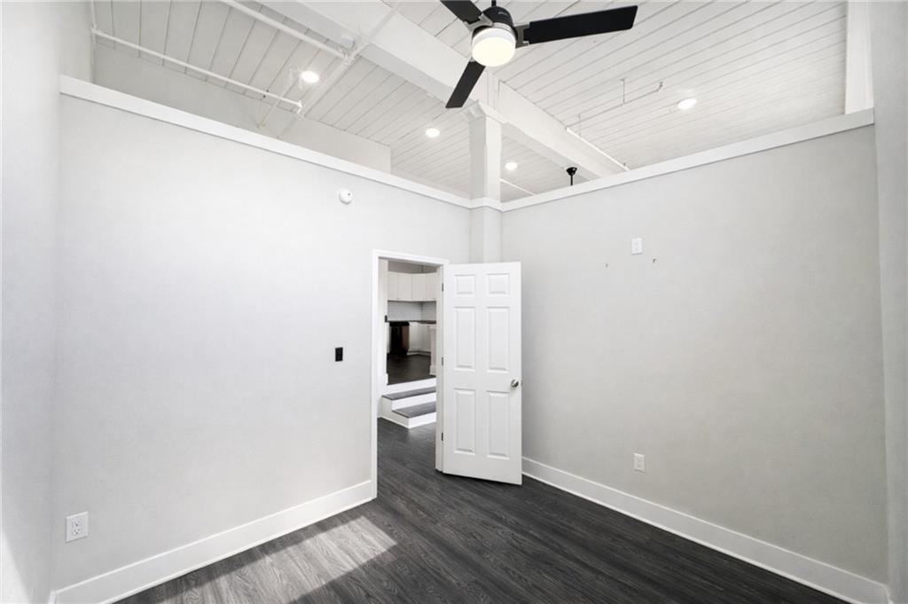 161 Mangum Street Southwest, Unit 204 Atlanta, GA 30313 - Photo 4 of 24 en empty room with wooden floor