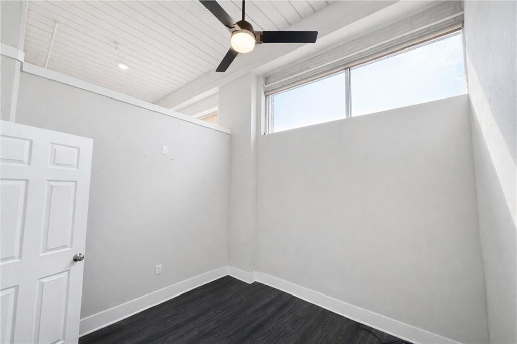 161 Mangum Street Southwest, Unit 204 Atlanta, GA 30313 - Photo 5 of 24 a view of a small space with wooden floor and a window