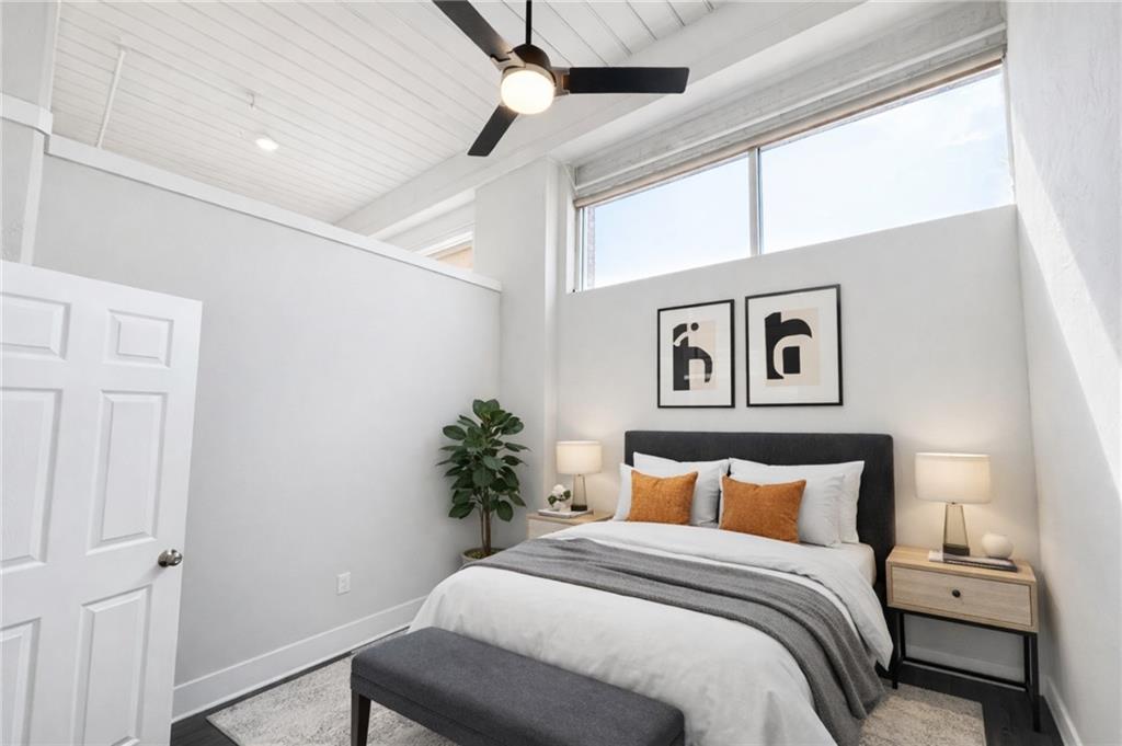 161 Mangum Street Southwest, Unit 204 Atlanta, GA 30313 - Photo 6 of 24 a bedroom with a bed and a potted plant