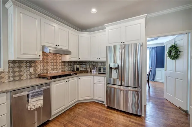 a kitchen with lots of counter space sink and appliances