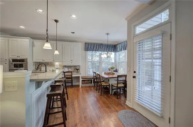 a dining room with furniture window wooden floor