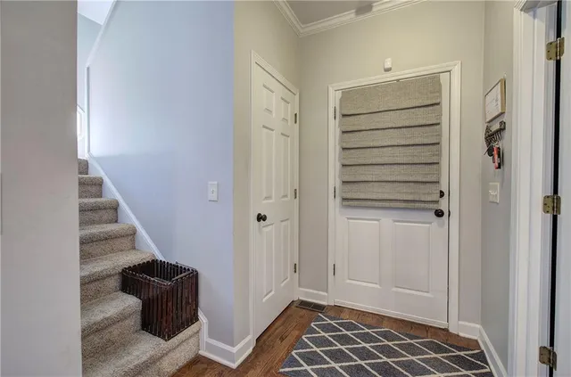 a bedroom with a large bed couch and a window