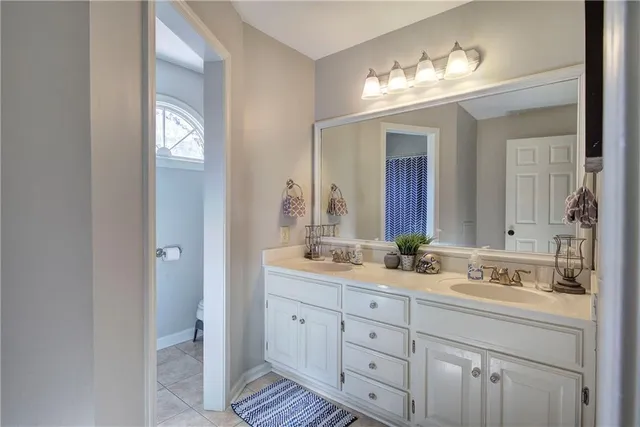 a view of a hallway with wooden floor and closet area