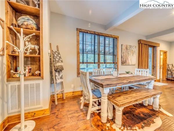 a room with a table and chairs