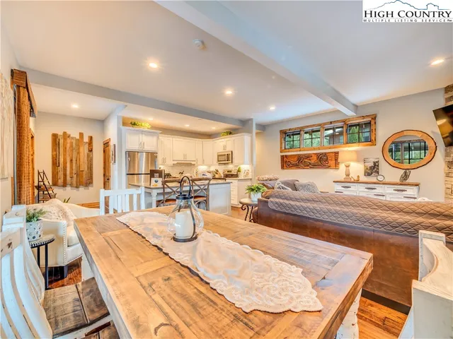 a very nice looking dining room with a table and chairs