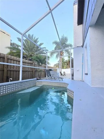a view of swimming pool from a balcony