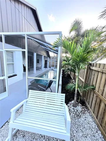 a kitchen with stainless steel appliances wooden cabinets and stove top oven