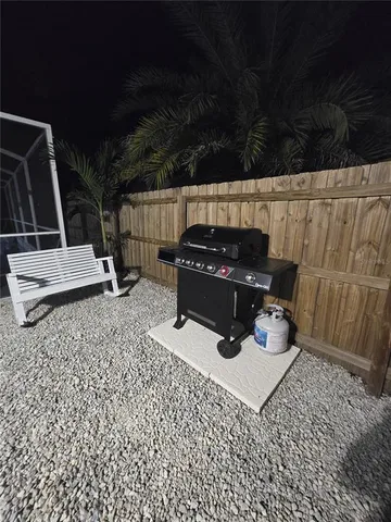 a kitchen with stainless steel appliances kitchen island granite countertop a sink and cabinets