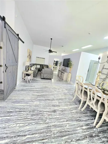 a living room with furniture and a bath tub