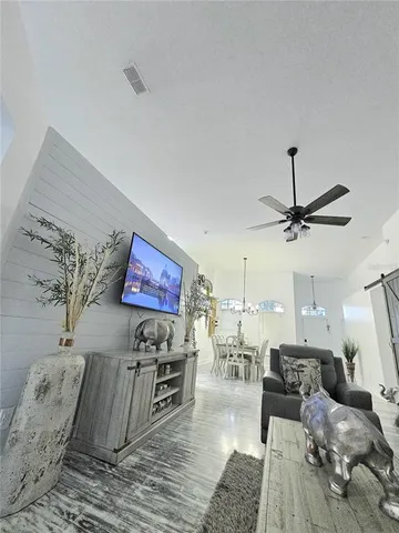 a bedroom with a bed and a mirror