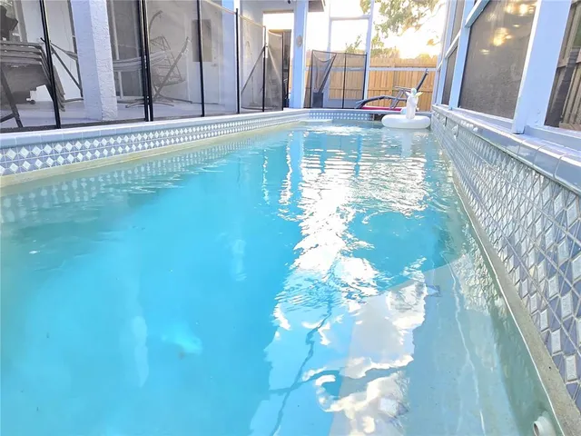 a view of a swimming pool with a porch