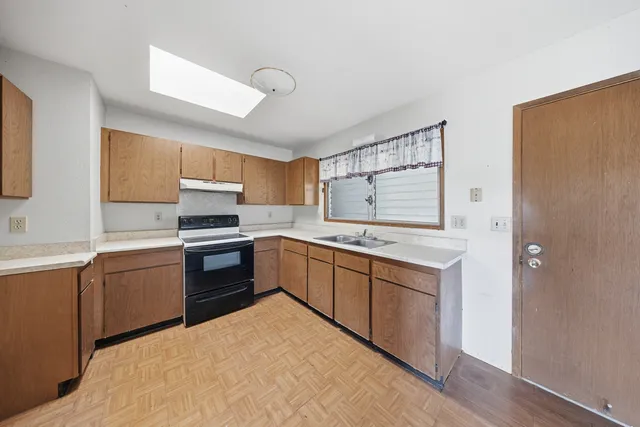 an aerial view of a house with a yard and garden