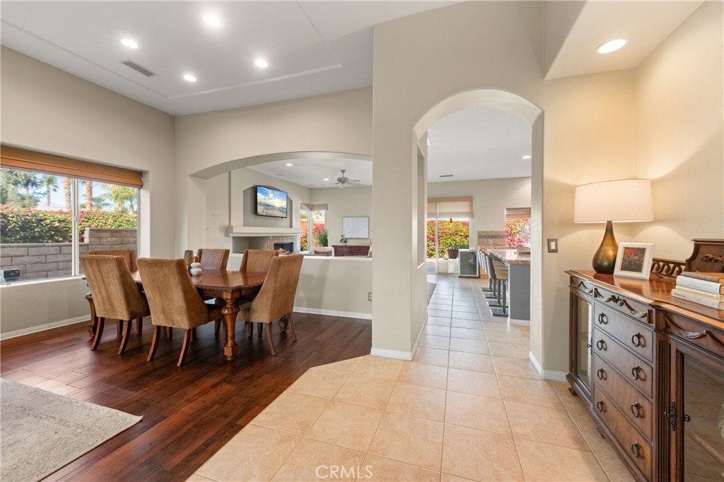 70 Rocio Court Palm Desert, CA 92260 - Photo 11 of 40 a view of a dining room with furniture window and wooden floor