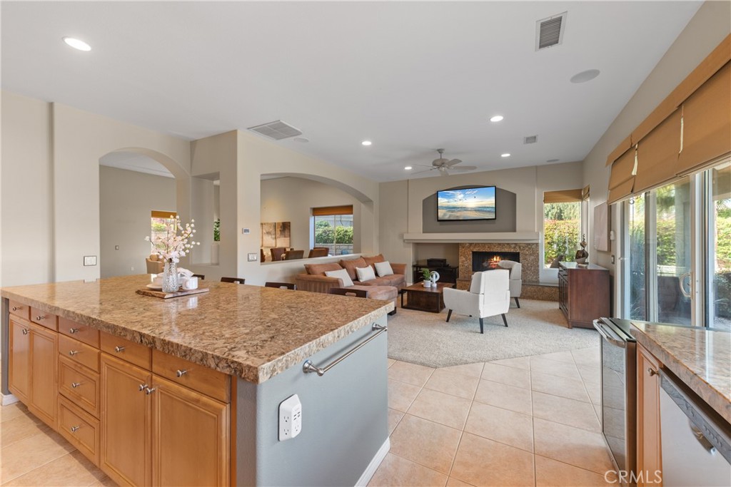 70 Rocio Court Palm Desert, CA 92260 - Photo 19 of 40 a view of living room with granite countertop furniture and fireplace